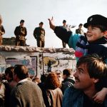 Boy Waves To Soldiers On The Berlin Wall