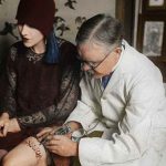 burchett-tattooing-a-woman